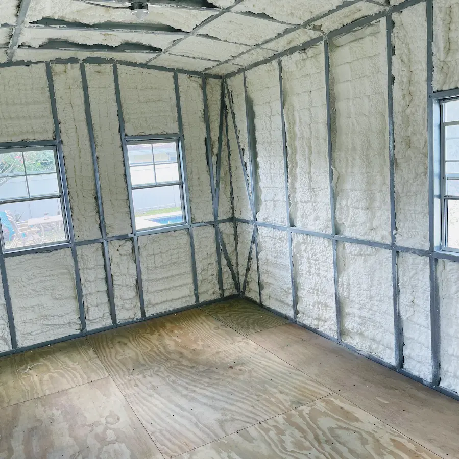 Closed-cell spray foam insulation applied to wall cavities in a residential project in Northlake
